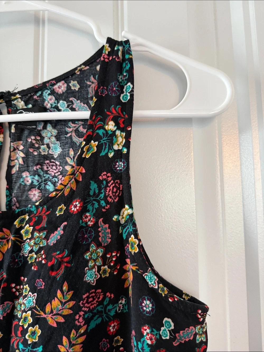 Gently worn Black Floral Ruffled Waist Sleeveless Romper